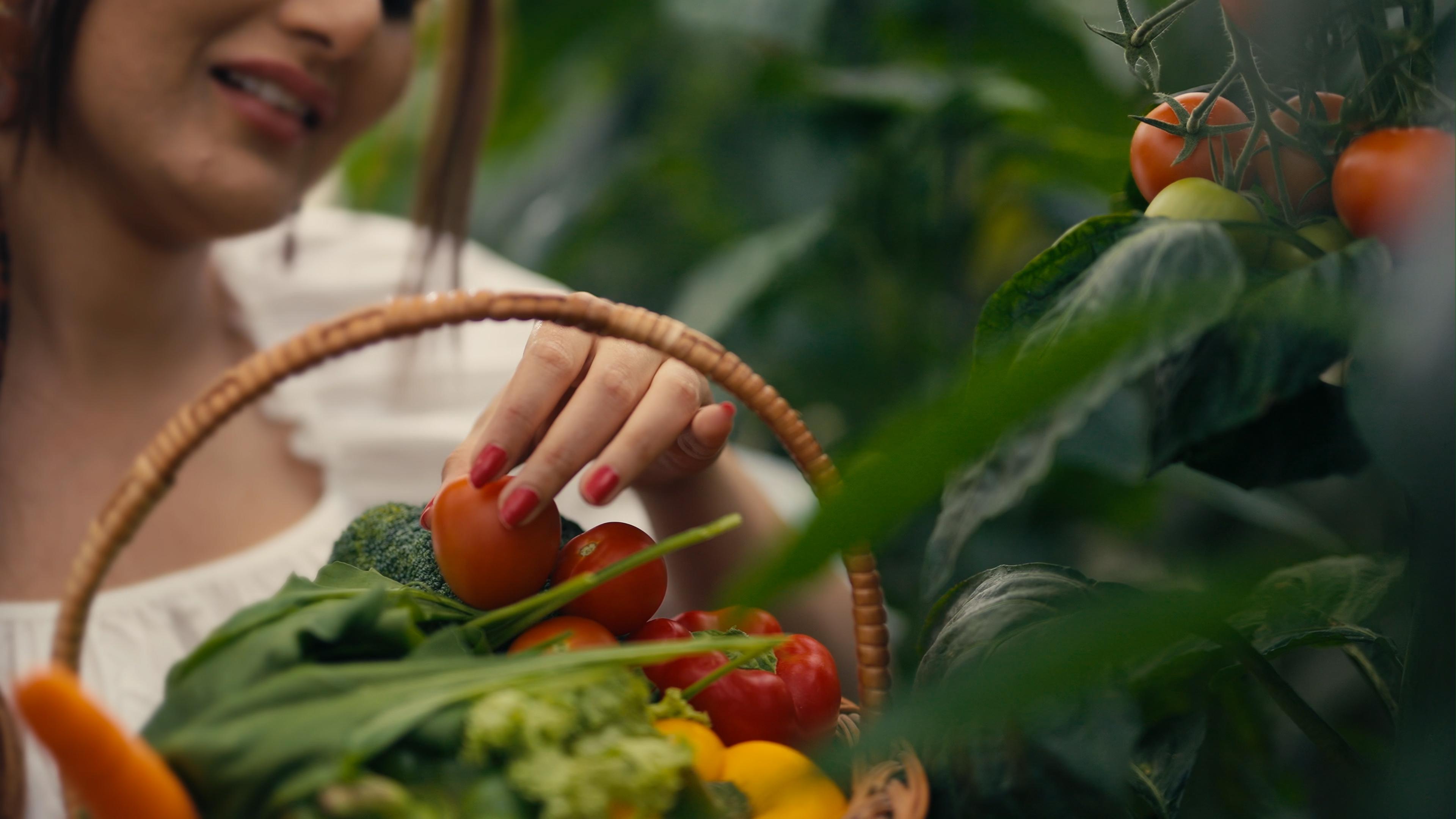 Woman with basket, natural greens